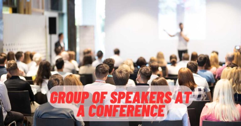 group of speakers at a conference